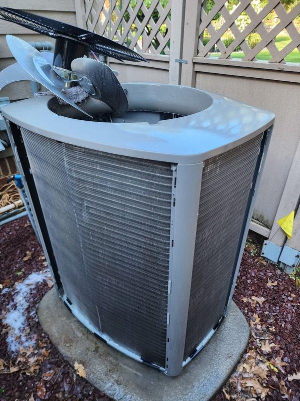 Completed scheduled AC maintenance on residential split system unit. Performed comprehensive inspection of outdoor condenser unit including fan motor operation, refrigerant line connections, and electrical components. Removed top panel to access and verify proper fan blade function and motor assembly. Inspected indoor air handler components including compressor unit, copper refrigerant lines, drain pan condition, and electrical wiring connections. All system components found operating within normal parameters with no issues identified during this preventative maintenance visit.