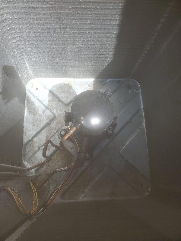 Completed comprehensive cooling system maintenance inspection on residential air conditioning system. Documented outdoor condensing unit with protective wrapping still in place and inspected ceiling-mounted indoor components including thermostat wiring connections. All equipment photographed for service records and system verified operational per Worry Free Service Agreement standards.