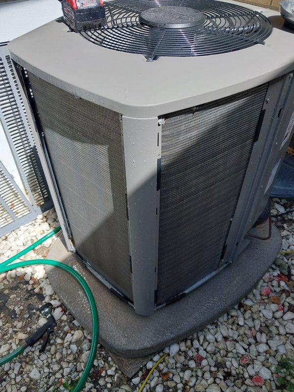 Completed scheduled cooling season maintenance on residential air conditioning system. Performed comprehensive inspection of outdoor condensing unit including condenser coil cleaning, verified proper operation of condenser fan motor and compressor, checked refrigerant levels through copper line set connections, and inspected electrical components including capacitor. All components found operating within normal parameters and unit left in proper working condition for cooling season.