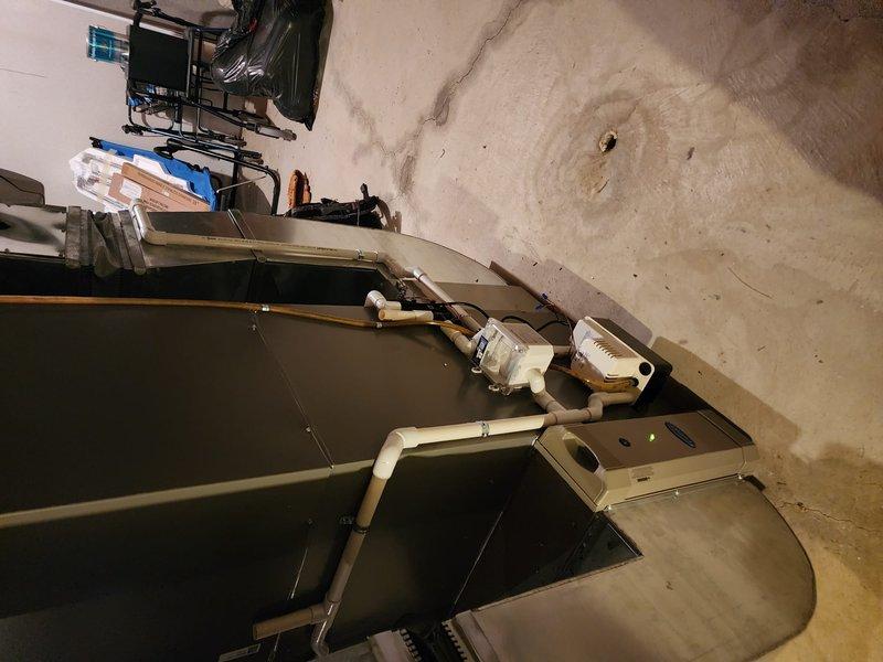 Completed full HVAC system installation including Lennox furnace, air conditioning unit, and S40 smart thermostat with refrigerant line connections and electrical integration. All equipment tested and operational, with copper line sets properly insulated and secured per manufacturer specifications.