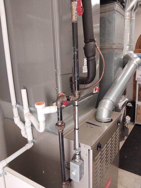 Responded to gas odor callback near recently installed furnace. Upon arrival, customer had already shut off gas supply as a safety precaution. Conducted thorough inspection of all gas piping connections, joints, and fittings throughout the installation using leak detection solution. Inspected gas valve connections at furnace inlet, union fittings, and black iron piping assembly. All connections tested tight with no leaks detected. Verified proper installation of gas line components and confirmed all fittings were properly torqued to manufacturer specifications. Inspected PVC venting system for proper installation and clearances. Checked condensate drainage piping and trap assembly. Restored gas supply and performed combustion analysis to verify safe operation. Unit fired normally with proper flame characteristics and no abnormal odors detected during operation. Educated customer on difference between initial gas odor from new equipment and actual gas leaks. System operating safely and 