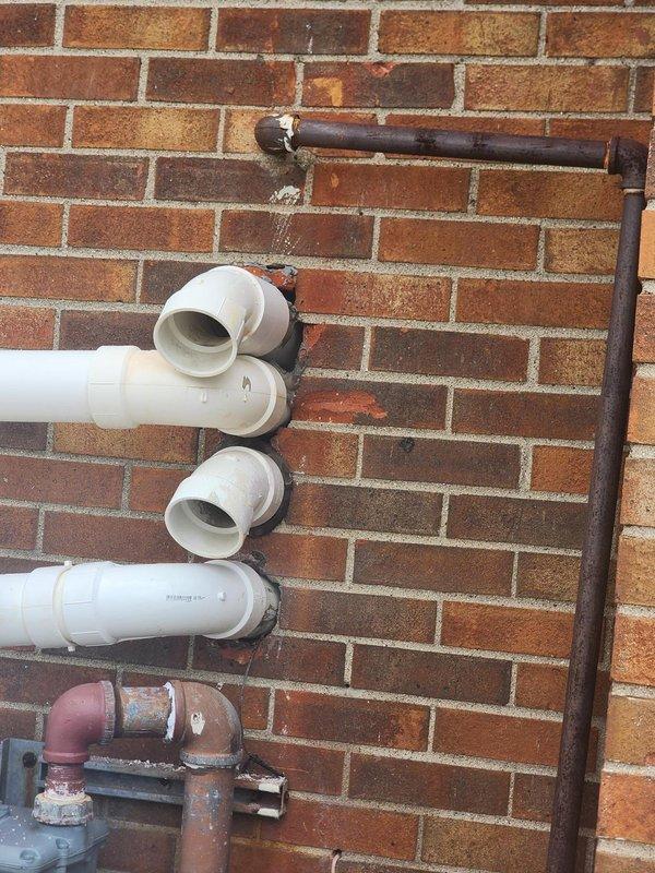 Responded to callback for HVAC installation to address drainage concerns. Repositioned and secured PVC condensate drain line to ensure proper fit against Lennox furnace unit, eliminating gaps and potential leak points. Applied mortar sealant around exterior PVC penetration through brick wall to weatherproof the installation and prevent moisture intrusion, completing the corrective work per original installation specifications.
