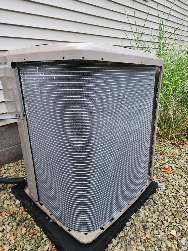 Completed comprehensive AC tune-up on residential outdoor condenser unit. Performed full system inspection, cleaned condenser coils showing dirt accumulation, verified proper fan motor operation, checked electrical connections and refrigerant lines, and confirmed unit is operating within normal parameters for the upcoming cooling season.