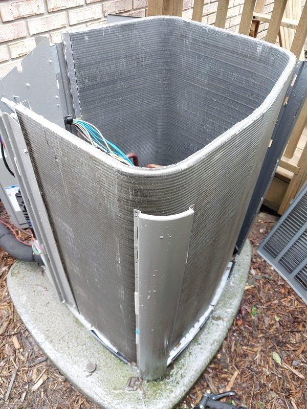 Completed preventive maintenance on residential split-system air conditioning unit including inspection of outdoor condensing unit and indoor evaporator coil assembly. Verified proper operation of compressor, refrigerant lines, electrical connections, and condensate drainage system; all components found in satisfactory working condition with normal wear patterns consistent with outdoor installation.