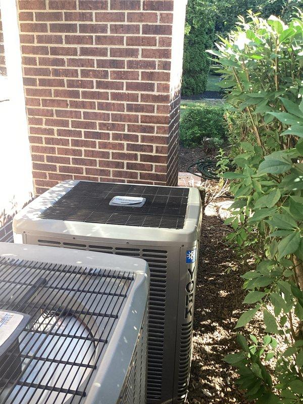Completed comprehensive AC replacement estimate for residential split-system installation. Evaluated existing Lennox indoor air handler unit with proper PVC venting configuration and assessed two outdoor condensing units positioned along exterior brick foundation. Documented current system specifications, installation conditions, and provided replacement recommendations for complete HVAC system upgrade.