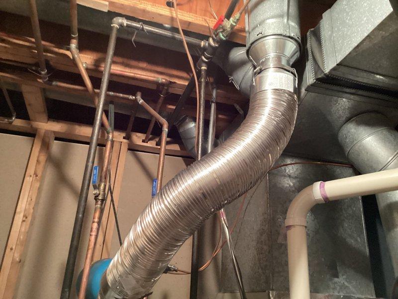 Completed installation of 50-gallon tanked water heater in residential basement utility space. Unit was properly positioned and secured, with all necessary water supply connections made using copper piping and appropriate shut-off valves. Gas line connections were completed to code specifications, and exhaust venting was installed to ensure safe operation and proper combustion air flow. All plumbing connections were pressure-tested for leaks, and the unit was filled, fired up, and verified to be heating properly. System was left in full operational condition with temperature controls set appropriately.
