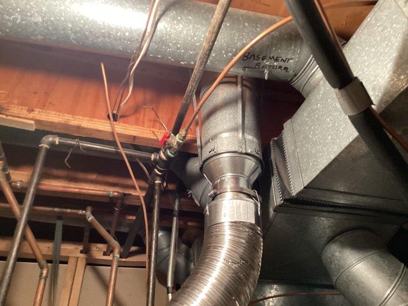 Completed installation of 50-gallon tanked water heater in residential basement utility space. Unit was properly positioned and secured, with all necessary water supply connections made using copper piping and appropriate shut-off valves. Gas line connections were completed to code specifications, and exhaust venting was installed to ensure safe operation and proper combustion air flow. All plumbing connections were pressure-tested for leaks, and the unit was filled, fired up, and verified to be heating properly. System was left in full operational condition with temperature controls set appropriately.
