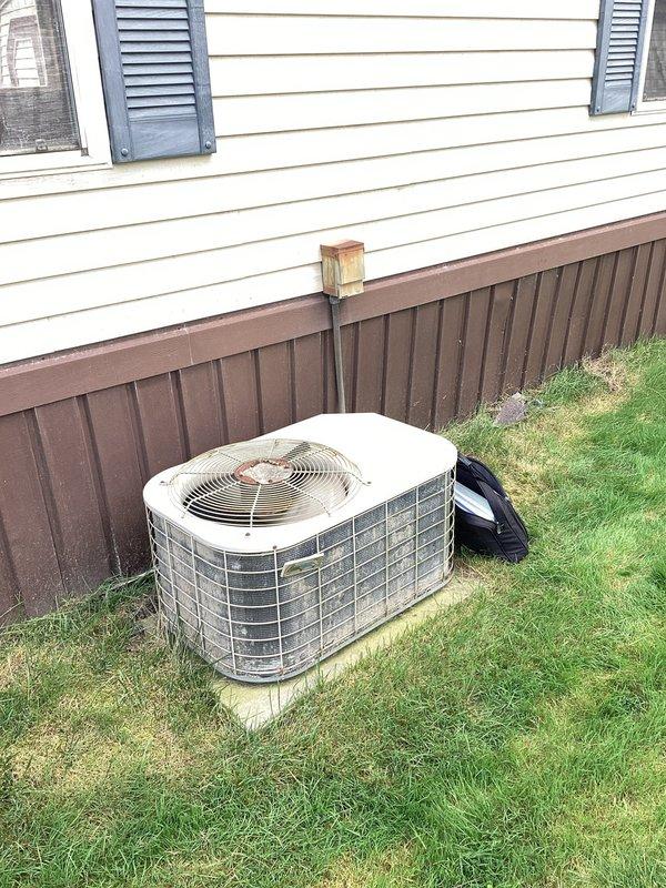 Completed comprehensive HVAC estimate for replacement of existing R22 air conditioning system. Evaluated current outdoor condensing unit positioned on concrete pad adjacent to residential structure, assessed system age and refrigerant type, and documented equipment condition through detailed photography. Provided homeowner with replacement options for upgrading to modern, environmentally-compliant refrigerant system with improved energy efficiency ratings.