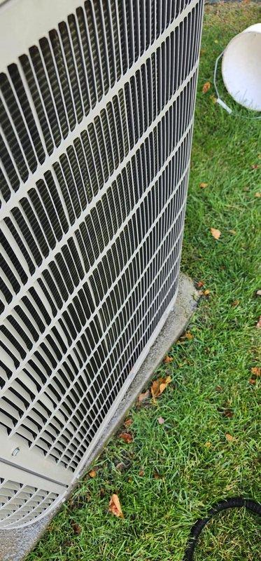 Completed scheduled preventative maintenance on residential split-system air conditioning unit. Performed comprehensive inspection of outdoor condenser unit, which showed normal operating condition with protective grille and housing intact. Inspected indoor air handler and drainage system, noting accumulated mineral deposits and staining in condensate pan consistent with normal operation. Verified refrigerant lines and insulation were properly secured, checked all mounting hardware and brackets for stability, and confirmed drain opening was clear and functional for proper condensate removal.