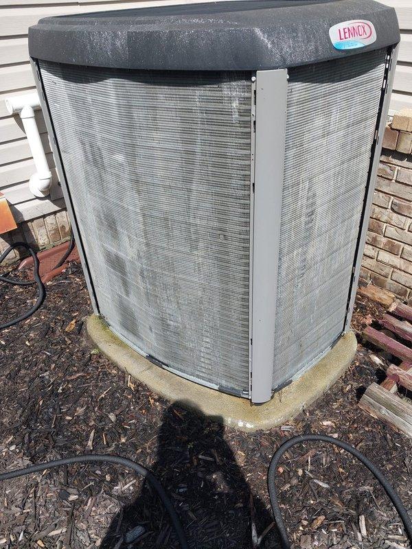 Completed annual preventive maintenance on 11-year-old Lennox air conditioning system per prepaid maintenance plan. Inspected outdoor condenser unit positioned on concrete pad adjacent to home exterior; verified proper operation of compressor, condenser fan motor, and electrical components. Cleaned condenser coil fins, checked refrigerant pressures, and tested capacitor performance. Inspected indoor air handler and evaporator coil assembly located in furnace; verified proper condensate drainage from drain pan, inspected refrigerant line insulation and electrical connections at air handler. All components operating within manufacturer specifications with no deficiencies noted at time of inspection.