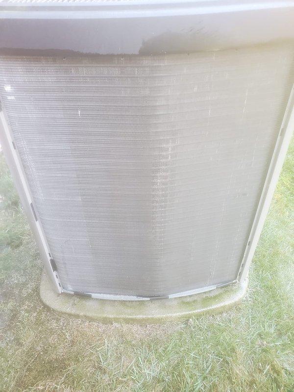 Completed scheduled AC maintenance service on residential cooling system. Performed comprehensive inspection of outdoor condensing unit, confirming proper exterior panel condition and structural integrity. Inspected indoor air handler components with focus on condensate drainage system. Evaluated condensate drain pan and float switch assembly, noting presence of water in pan with visible algae growth or chemical treatment residue. Verified float mechanism operation and proper mounting of drainage components. All mechanical systems found functional with no immediate service requirements identified beyond routine maintenance observations.