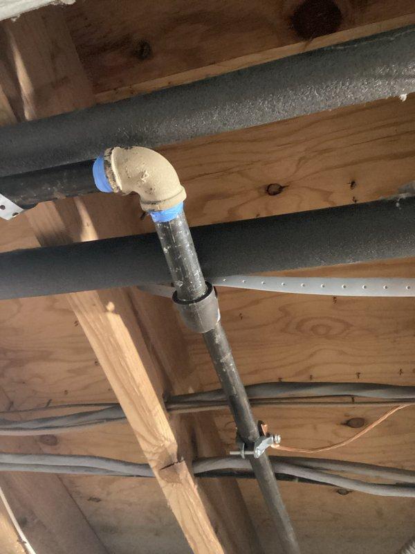 Completed estimate for conversion of existing electric water heater to gas-fired unit in the 10-12 gallon capacity range. Assessed attic space and existing plumbing infrastructure, including PVC venting system currently routed through ceiling joists with proper support brackets and insulation clearances. Evaluated HVAC ductwork and ventilation pathways to determine optimal routing for new gas water heater exhaust venting and combustion air requirements. Provided comprehensive assessment of necessary modifications including gas line installation, venting reconfiguration, and removal of existing electric unit.