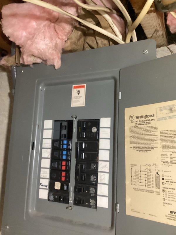 Performed comprehensive electrical assessment for generator installation at residential property. Evaluated existing electrical infrastructure including main service panel located in attic space and exterior meter configuration serving multiple units. Documented current electrical panel capacity, breaker arrangement, and available circuits in Westinghouse load center to determine compatibility with proposed generator system. Assessed exterior meter bank installation consisting of two digital smart meters and one DTS meter with associated conduit runs to identify proper connection point for generator transfer equipment. Captured detailed photographic documentation of panel interior showing circuit breaker layout and available spaces, as well as exterior service entrance configuration including PVC and metallic conduit routing for preparation of formal generator installation estimate.
