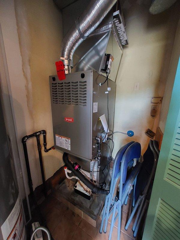 Responded to service call for condensate pump continuously running in condo unit. Upon inspection, found Bryant HVAC system with condensate drain assembly operating improperly. Diagnosed faulty condensate pump float switch causing pump to run constantly without cycling off. Tested electrical connections and verified proper drainage flow through white PVC condensate piping. Adjusted float mechanism and confirmed pump now cycles correctly with normal operation restored.