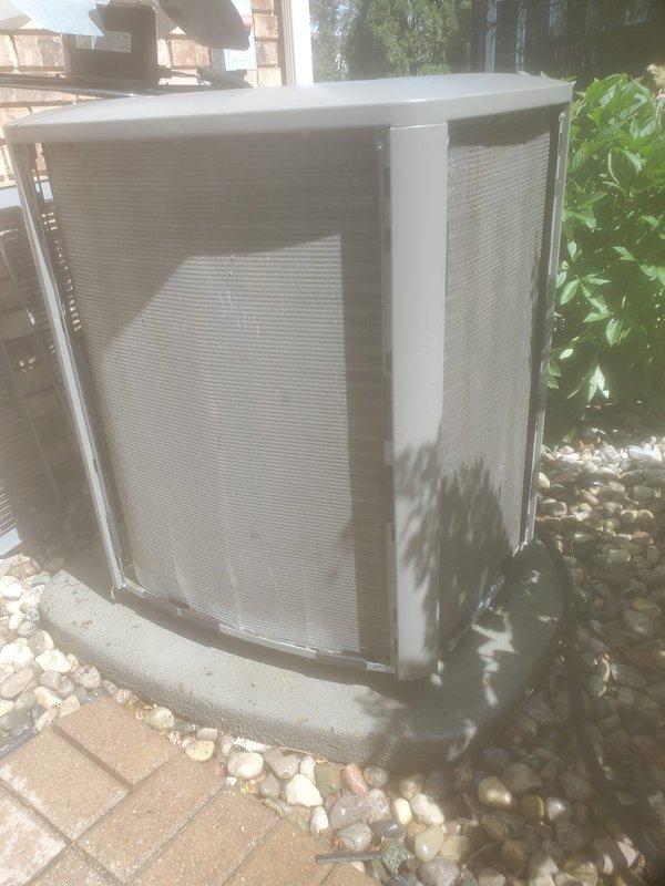 Completed scheduled AC maintenance on residential split system. Inspected indoor air handler unit located in attic space and outdoor condensing unit. Indoor unit showed significant frost accumulation on refrigerant lines, indicating potential low refrigerant charge or restricted airflow issue. Verified condensate pump operation with illuminated indicator light functioning properly and drain pan collecting moisture as designed. Outdoor condenser unit inspected on concrete pad with mesh grilles intact and unit operating. Documented system conditions with photographs for service records. System requires follow-up evaluation to address refrigerant line frosting and determine if refrigerant charge adjustment or airflow correction is needed to prevent future operational issues.