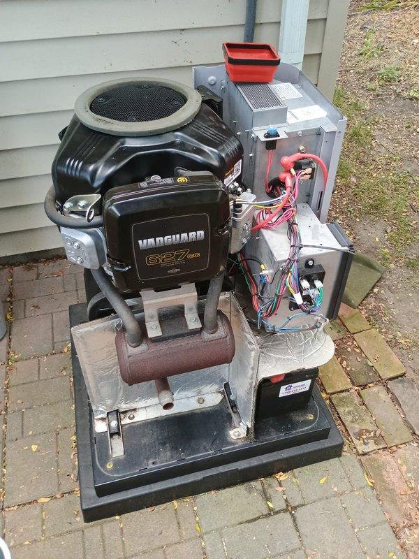 Performed scheduled maintenance on residential Vanguard 627cc standby generator unit. Inspected and replaced worn spark plugs showing carbon deposits and electrode wear. Verified all electrical connections, control box wiring, and mounting hardware for proper operation and security.