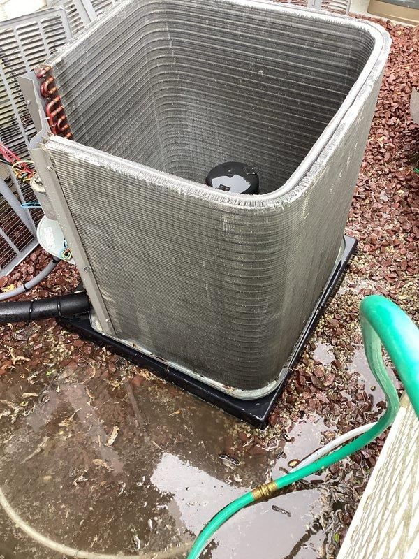 Completed scheduled cooling maintenance on residential HVAC system. Performed comprehensive inspection of indoor air handler unit, verifying proper motor mount assembly, electrical connections, and refrigerant line integrity. Inspected outdoor condenser unit, noting weathered exterior casing with normal patina from environmental exposure. Cleaned condenser coils and surrounding area, confirmed unit operating on proper pad with adequate drainage. All electrical connections, refrigerant lines, and mechanical components found secure and functioning within normal parameters.