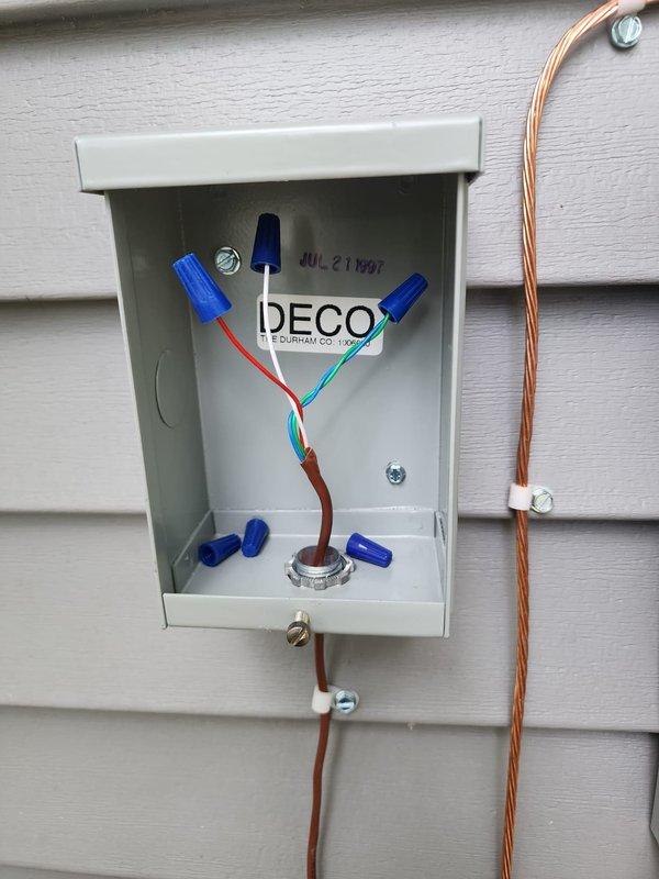 Completed full HVAC system replacement including installation of Lennox 80% efficiency gas furnace, new central air conditioning unit, and T6 programmable thermostat for improved climate control and energy management. Installed 50-gallon residential water heater with new chimney liner to ensure proper venting and code compliance. Added electrical disconnect box with fused switches for AC unit, wired with appropriate 240V service including hot conductors, neutral, and ground connections, and installed exterior junction box with properly secured wire connections and strain relief fittings mounted to building exterior. Configured system for interruptible service capability as requested, completing all electrical connections with code-compliant wire nuts and cable management.