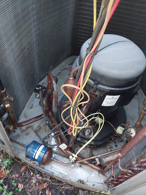 Completed scheduled A/C maintenance on outdoor condensing unit. Performed comprehensive system inspection including visual assessment of compressor assembly, refrigerant lines, electrical connections, and condenser coil condition. Unit showed typical operational wear with accumulated dirt and debris on condenser fins and base pan. All copper refrigerant lines, electrical wiring, and compressor components were inspected and found to be functioning properly with no refrigerant leaks detected.