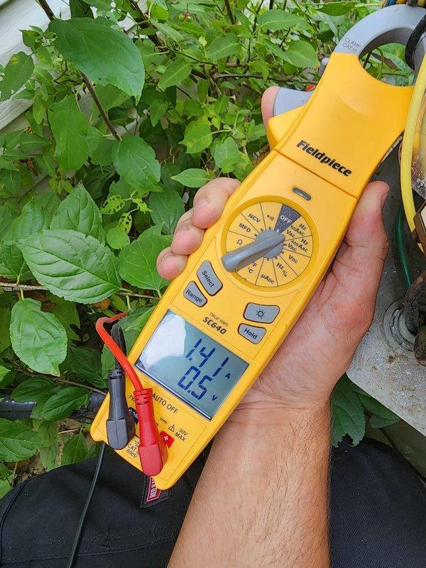 Completed routine air conditioning maintenance during scheduled prepaid visit. Performed standard system diagnostics including electrical measurements with clamp meter, recording operating voltage and amperage to verify proper compressor and condenser function. Inspected outdoor condensing unit for proper operation, confirmed adequate airflow through condenser coil, and verified system is operating within manufacturer specifications.