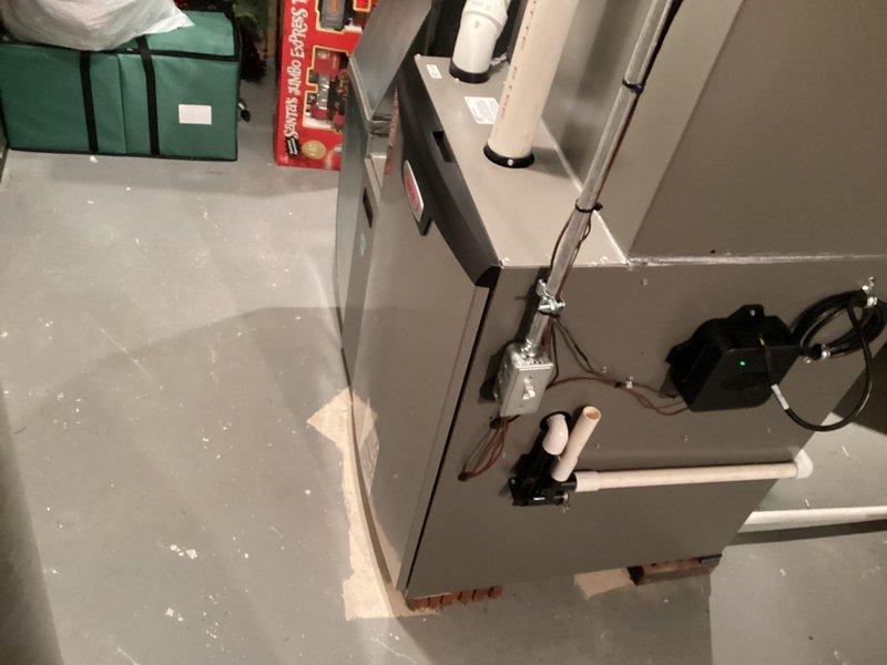 Completed installation of new Lennox air conditioning system including indoor air handler unit and digital programmable thermostat. System was fully commissioned, tested for proper operation, and thermostat programmed to customer specifications with all settings verified through the advanced diagnostics menu.