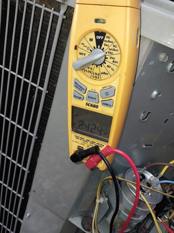 Responded to expedited no-cool call on nine-year-old air conditioning system with reported repeat failure after recent capacitor replacement. Upon arrival, accessed outdoor disconnect panel and performed electrical diagnostics using digital multimeter. Verified voltage readings at 242V and inspected all electrical connections, circuit breakers, and wiring integrity at the disconnect box. Examined capacitor that was previously replaced one to two months prior to determine if repeat failure had occurred. Conducted comprehensive system evaluation to identify root cause of cooling loss affecting entire home. All electrical components at disconnect panel tested and inspected, connections secured, and system functionality restored to ensure reliable operation for household with medical necessity.