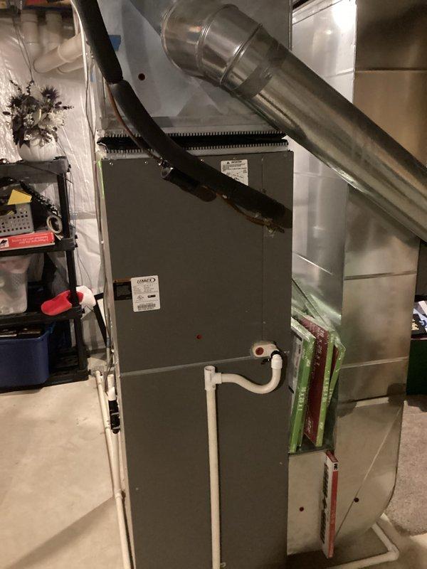 Completed comprehensive HVAC system replacement in residential basement, installing new air handler unit with associated ductwork, PVC condensate drain lines, and water heater. All equipment properly secured, connected, and tested with new filtration system in place and operational.