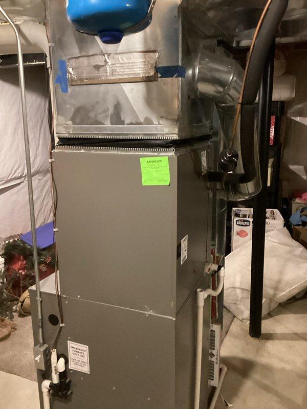 Completed comprehensive HVAC system replacement in residential basement, installing new air handler unit with associated ductwork, PVC condensate drain lines, and water heater. All equipment properly secured, connected, and tested with new filtration system in place and operational.