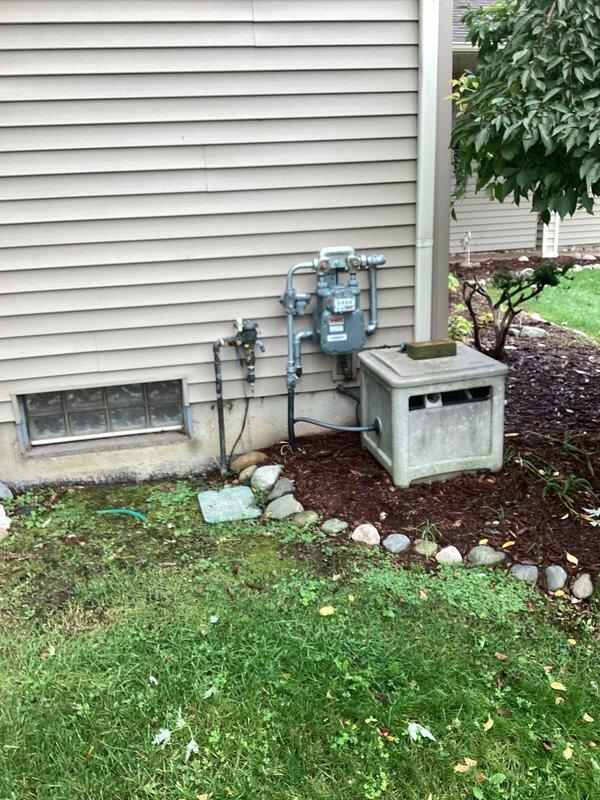 Conducted comprehensive site evaluation for standby generator installation at residential property. Assessed existing natural gas utility infrastructure, evaluated optimal placement location considering clearance requirements from gas meter and HVAC equipment, and documented site conditions including foundation access, ground cover vegetation, and adequate clearances from windows and property boundaries for code-compliant generator installation.