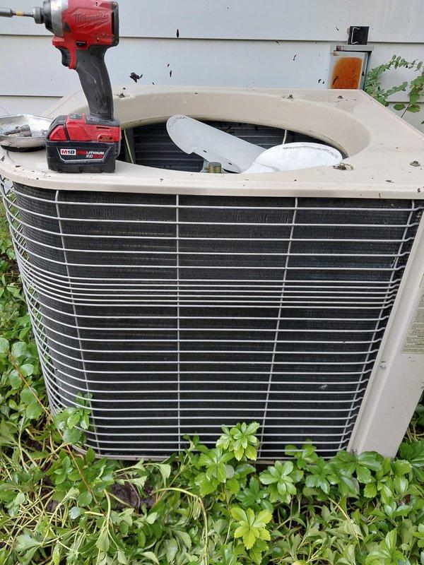 Completed preventative maintenance on residential air conditioning system. Accessed outdoor condenser unit, inspected internal components including coil assembly and fan motor, cleaned debris and vegetation growth from around unit base and exterior surfaces. Verified proper operation of all mechanical and electrical components per manufacturer specifications.