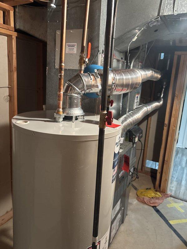 Completed installation of a 50-gallon residential tanked water heater in utility room. Removed existing unit, installed new water heater with proper copper piping connections, pressure relief valve, and shut-off valve. All connections were tested for leaks and unit was verified operational upon completion.