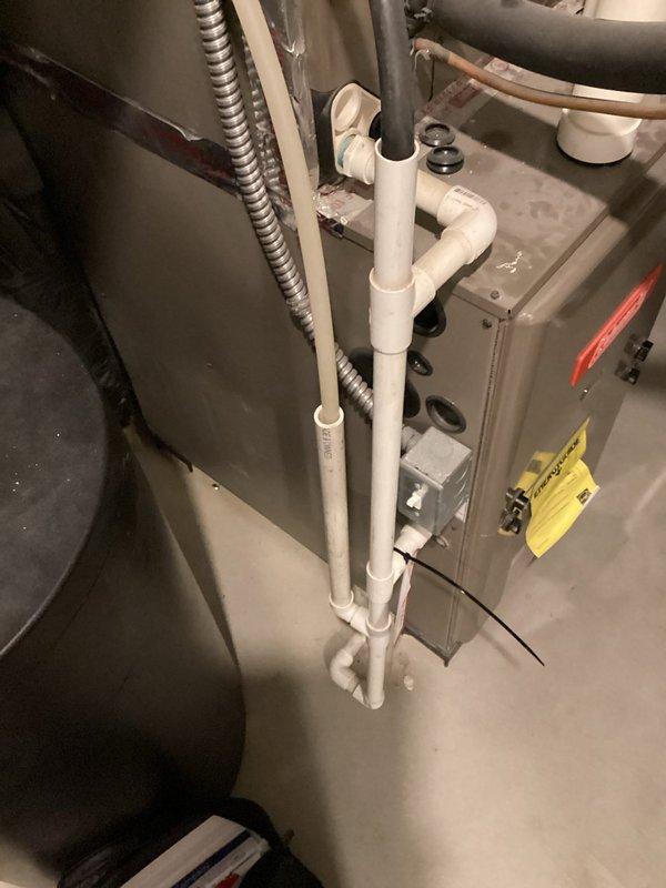 Performed comprehensive assessment of residential furnace system following heat exchanger failure diagnosis. Documented existing HVAC installation including furnace unit, metal ductwork configuration, PVC condensate drain and exhaust piping, and associated mechanical connections. Prepared detailed equipment replacement estimate for failed heat exchanger requiring furnace replacement due to safety concerns and system integrity. Photographed current installation setup showing proper drainage system, electrical conduit routing, and mechanical room layout to facilitate accurate equipment specification and installation planning.