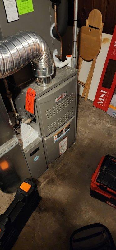 Performed comprehensive furnace maintenance and tune-up on Lennox heating system. Conducted complete system inspection, cleaned and checked all furnace components, verified proper operation of blower motor and heat exchanger, inspected electrical connections and wiring, tested safety controls and limit switches, and examined venting system including PVC condensate drainage. Confirmed system operating properly with no issues found. Unit functioning as designed at time of service completion.