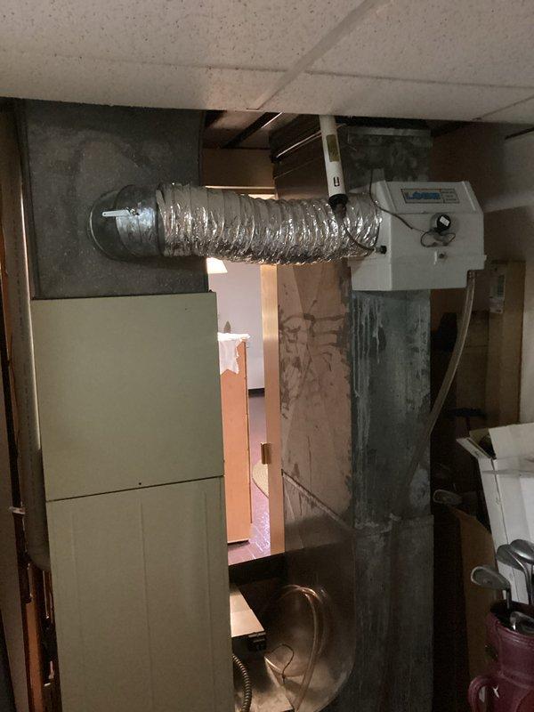 Completed furnace replacement estimate for a 40-year-old heating system with a rusted-out secondary heat exchanger. Documented existing equipment condition and confirmed replacement parts are no longer available due to system age, necessitating full unit replacement.