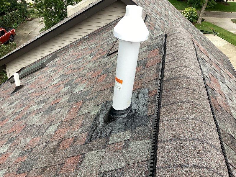 Responded to callback for roof leak associated with furnace vent pipe penetration. Installed proper flashing and weatherproofing around the white PVC vent pipe where it exits through the asphalt shingle roof. Applied roofing sealant at the base of the penetration to ensure water-tight seal and prevent future moisture intrusion. Verified vent pipe is properly secured in attic space with mounting brackets and confirmed adequate clearance from insulation materials.