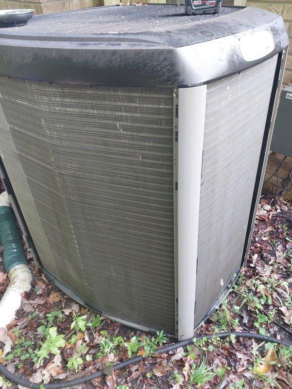 Completed comprehensive cooling season maintenance on outdoor condensing unit. Performed visual inspection of exterior cabinet, coil surfaces, and internal components including compressor, capacitor, refrigerant lines, and electrical connections. Unit showed typical weathering and debris accumulation around base and coil fins consistent with outdoor exposure. All critical components operational and system ready for cooling season demand.