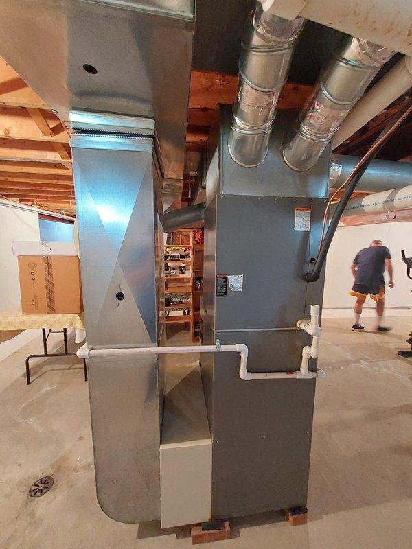 Performed routine maintenance on tanked water heater under warranty plan coverage. Conducted comprehensive inspection of unit, including examination of all manufacturer labels, specification plates, and safety warnings for compliance and readability. Verified proper operation of flue pipe connection and venting system extending to overhead ductwork. Inspected all plumbing connections at base of unit, including water supply lines, discharge piping, and gas line fittings for leaks or deterioration. Checked condition of installation platform and surrounding concrete floor for moisture or structural concerns. Confirmed proper clearances around unit and verified basement ventilation adequate for safe operation. Unit found to be functioning within normal parameters with no immediate repairs required.