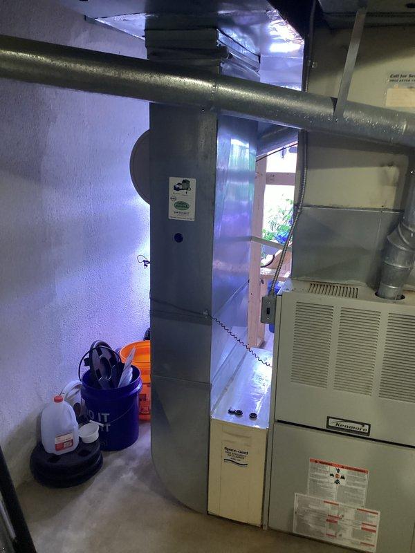 Completed comprehensive HVAC system replacement estimate for 30-year-old equipment showing signs of failure. Assessed existing furnace and air handler installation in basement utility area, documenting current system configuration including ductwork connections, refrigerant lines, and electrical components. Photographed equipment layout and existing infrastructure to develop accurate replacement specifications and identify any additional modifications required for new system installation.