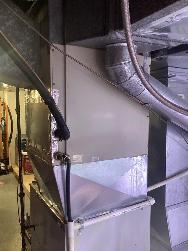 Completed comprehensive HVAC system replacement estimate for 30-year-old equipment showing signs of failure. Assessed existing furnace and air handler installation in basement utility area, documenting current system configuration including ductwork connections, refrigerant lines, and electrical components. Photographed equipment layout and existing infrastructure to develop accurate replacement specifications and identify any additional modifications required for new system installation.