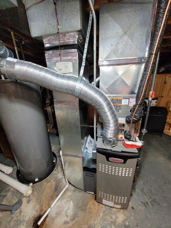 Completed full HVAC system installation including Lennox 80% efficiency furnace, air conditioning unit, and whole-home humidifier in basement mechanical room. Replaced existing refrigerant lineset with new copper lines and upgraded dryer gas connection from flexible connector to rigid black iron hardpipe per code requirements. All equipment properly mounted, vented, and tested for optimal performance with system commissioned and operational upon completion.