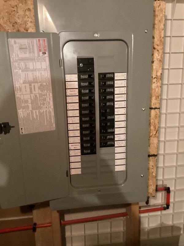 Completed comprehensive HVAC system replacement estimate for residential property. Assessed existing Bryant furnace installation in basement utility area, including evaluation of ductwork configuration, condensate drainage system with white PVC piping, and electrical service panel with dedicated circuit breakers. Documented current equipment specifications, manufacturer labels, and system components to provide accurate replacement recommendations for high-efficiency heating system upgrade.