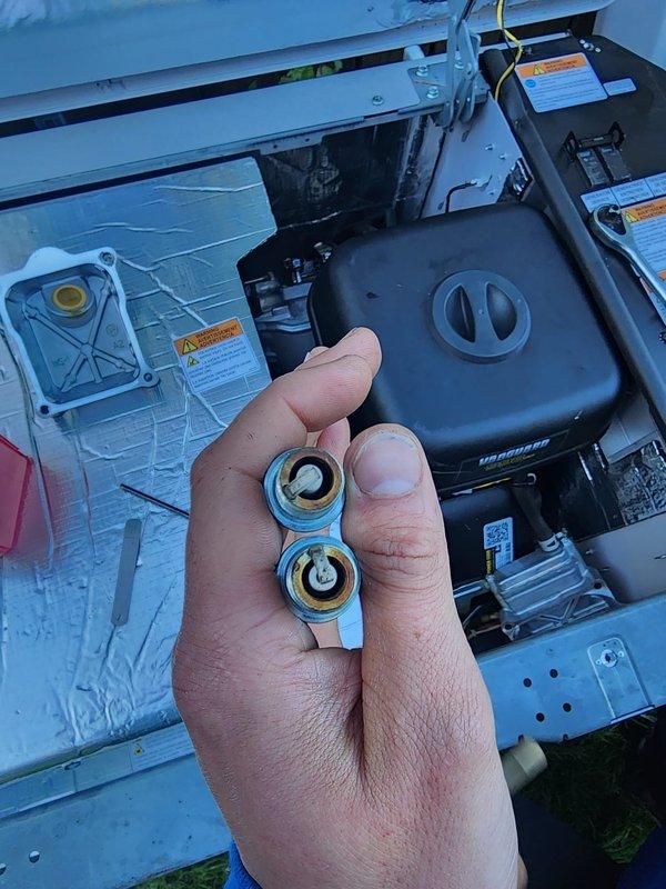 Performed scheduled maintenance on residential standby generator system. Conducted thorough inspection of internal components, including ignition system, fuel delivery assembly, and electrical connections. Removed and inspected gas valve assembly, verifying proper operation of all safety mechanisms and fuel flow controls. Replaced worn mounting bracket with brass grommets to ensure secure component installation. Checked all wiring harnesses for proper connections and signs of wear, with particular attention to power supply lines and ground connections. Verified proper ventilation clearances and confirmed all warning labels remained legible and properly affixed. Tested unit operation and confirmed all systems functioning within manufacturer specifications.