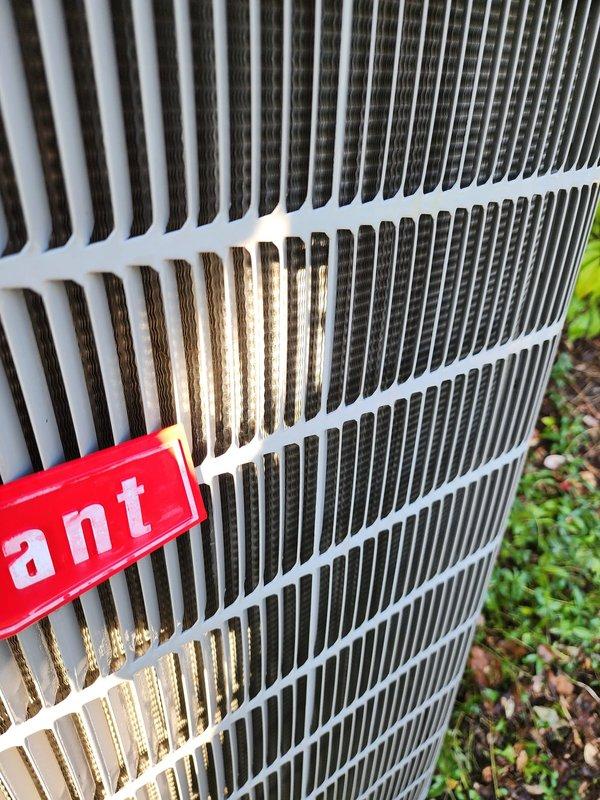 Completed comprehensive cooling season maintenance on residential air conditioning system. Performed thorough inspection of outdoor condenser unit, verified proper airflow through protective grille and coil fins, and examined compressor operation with associated copper refrigerant lines and electrical connections. Confirmed drain pan condition and documented system components in normal operating condition per Worry Free Service Agreement protocol.
