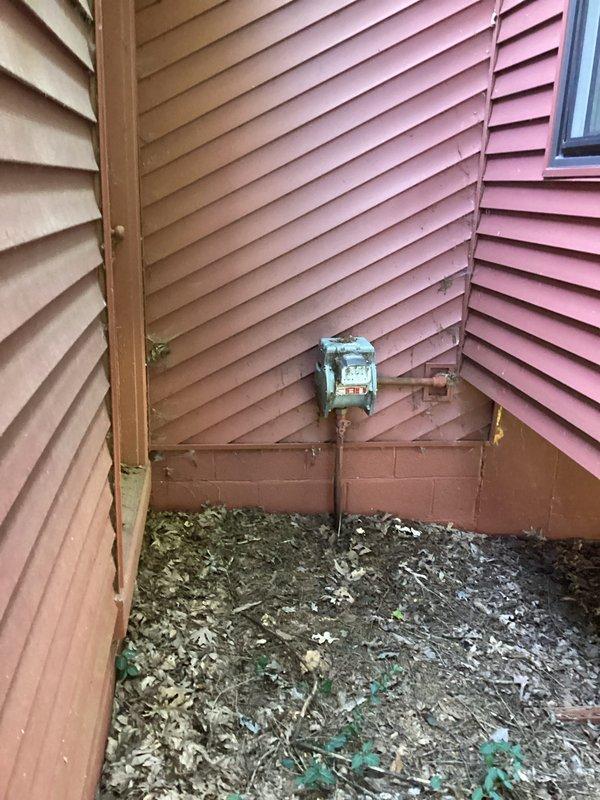 Conducted on-site electrical assessment for standby generator installation at residential property. Evaluated existing electrical service infrastructure, including current meter base and main service panel configuration. Documented exterior utility access points and determined optimal generator placement location considering clearance requirements, fuel line routing, and transfer switch installation parameters. Photographed existing electrical meter installation with orange service panel and conduit routing to assess compatibility with automatic transfer switch integration. Assessed site conditions including building exterior access, foundation clearances, and utility corridor for generator pad placement and electrical connections. Provided customer with comprehensive estimate range for complete generator system installation including unit specifications, transfer switch options, and necessary electrical modifications. Scheduled follow-up installation pending customer approval, accommo