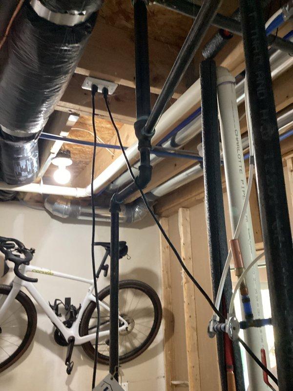 Conducted on-site assessment of existing Bradford White 50-gallon power vent water heater in basement utility area. Documented current equipment configuration, including venting system, gas connections, and proximity to existing water softener and HVAC equipment. Photographed installation area showing concrete block walls, exposed ceiling joists with existing plumbing and ductwork routing, and available clearances for replacement unit. Prepared comprehensive replacement estimate for new power vent water heater with comparable specifications.