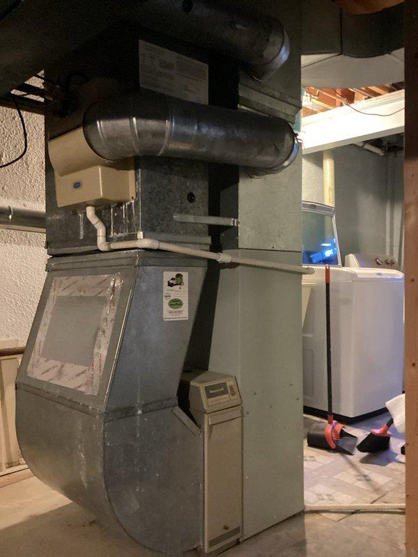 Provided comprehensive estimate for full HVAC system replacement of 30-year-old natural gas furnace and air handler currently located in basement utility area. Existing equipment remains operational but has reached end of expected service life. Documented current system configuration including ductwork connections, air distribution components, and mechanical layout to develop replacement specifications for new high-efficiency heating and cooling system.