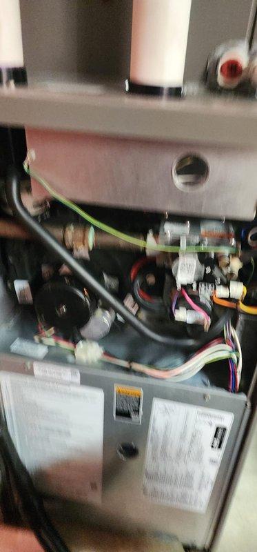 Completed comprehensive Worry Free Service Agreement maintenance on heating and air conditioning system. Performed thorough inspection of furnace components including burner assembly, heat exchanger, electrical connections, and control board, with all wiring harnesses and safety devices verified operational. Conducted air conditioning system diagnostics using manifold gauges, confirming R-410A refrigerant pressures and temperatures within manufacturer specifications at 406 PSI and 117°F, with system operating efficiently at measured parameters.