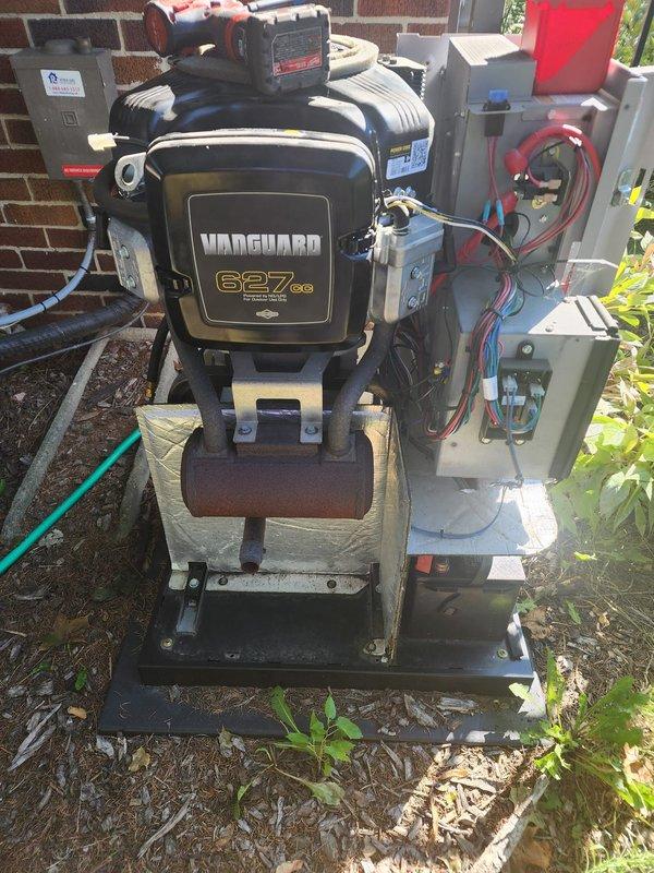 Performed scheduled maintenance on outdoor standby generator unit equipped with Vanguard 627cc engine. Inspection revealed aging electrical components requiring replacement. Removed and replaced faulty capacitors from the control system to ensure reliable operation. Verified all electrical connections in the junction box, securing loose wiring including red, blue, and white conductor leads. Tested engine start sequence and confirmed proper operation of all control systems. Unit returned to full operational status with improved electrical component reliability.