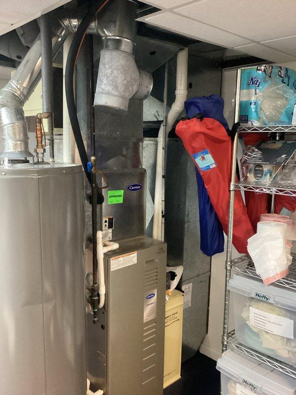 Provided estimate for replacement of existing Carrier furnace system, currently operational but 15-20 years old and nearing end of service life. Assessed current installation including ductwork configuration, electrical connections, and venting system in basement utility area. Documented existing equipment specifications and discussed replacement options with homeowner for scheduled appointment window.