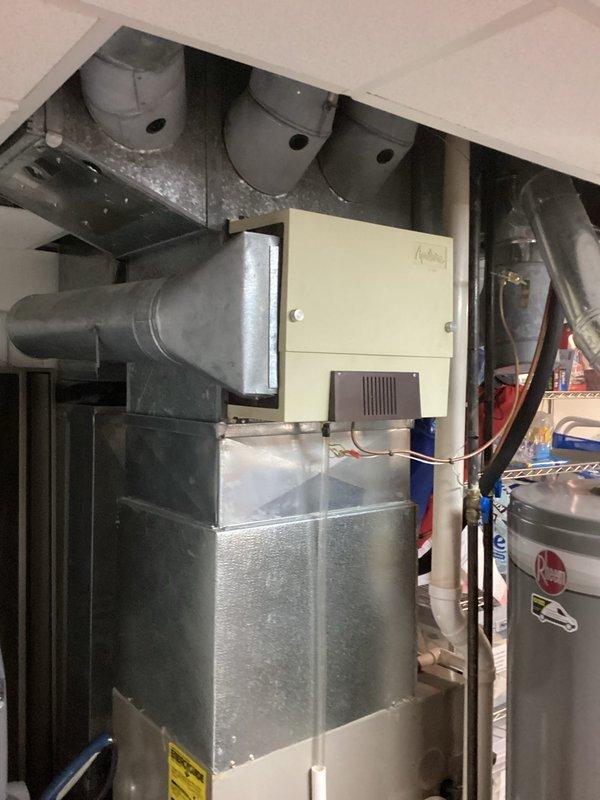 Provided estimate for replacement of existing Carrier furnace system, currently operational but 15-20 years old and nearing end of service life. Assessed current installation including ductwork configuration, electrical connections, and venting system in basement utility area. Documented existing equipment specifications and discussed replacement options with homeowner for scheduled appointment window.